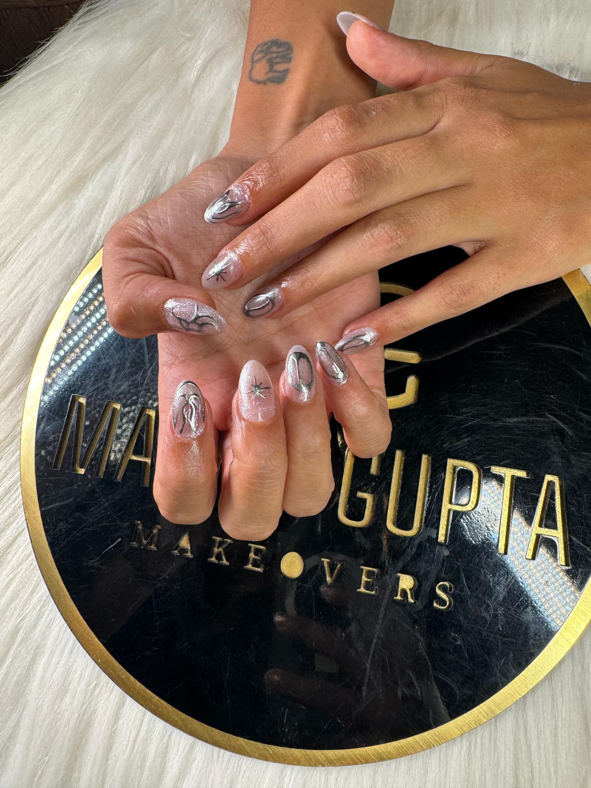 Silver chrome abstract nail art at MG Makeovers