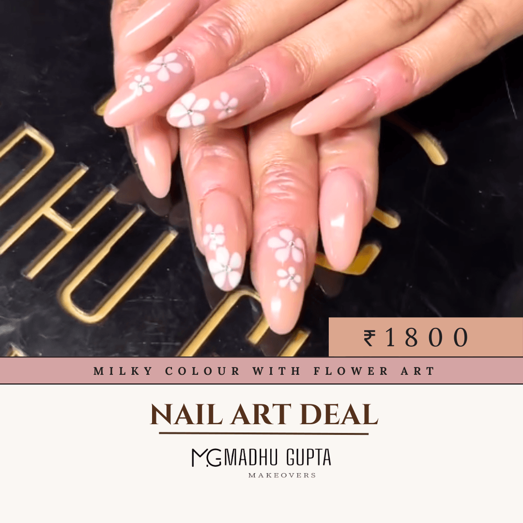 Milky pink nails with delicate hand-painted flower art at MG Makeovers, Gurgaon