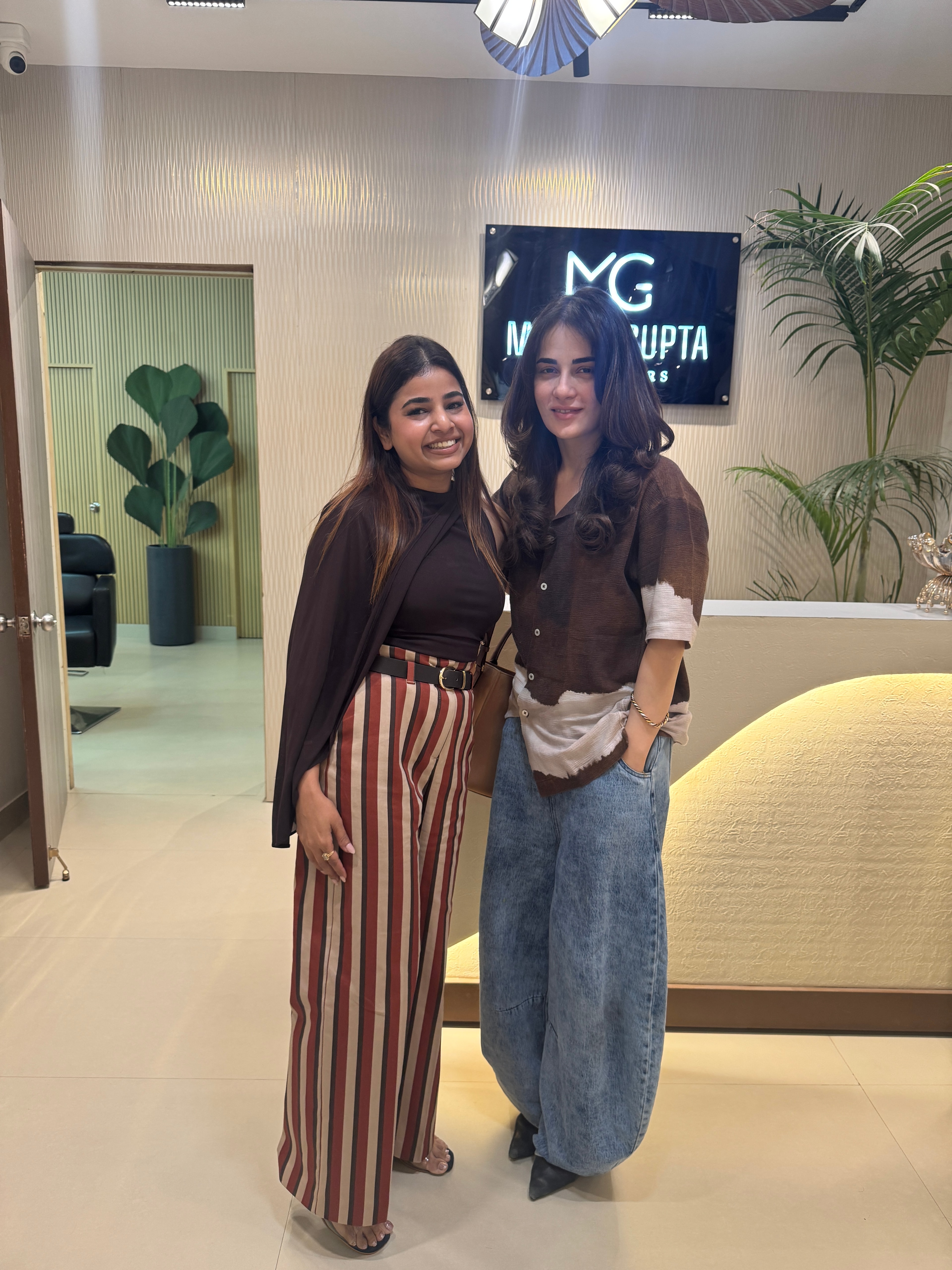 Madhu Gupta standing with Bollywood actor Radhika Madan at the MG Makeovers studio in Gurugram