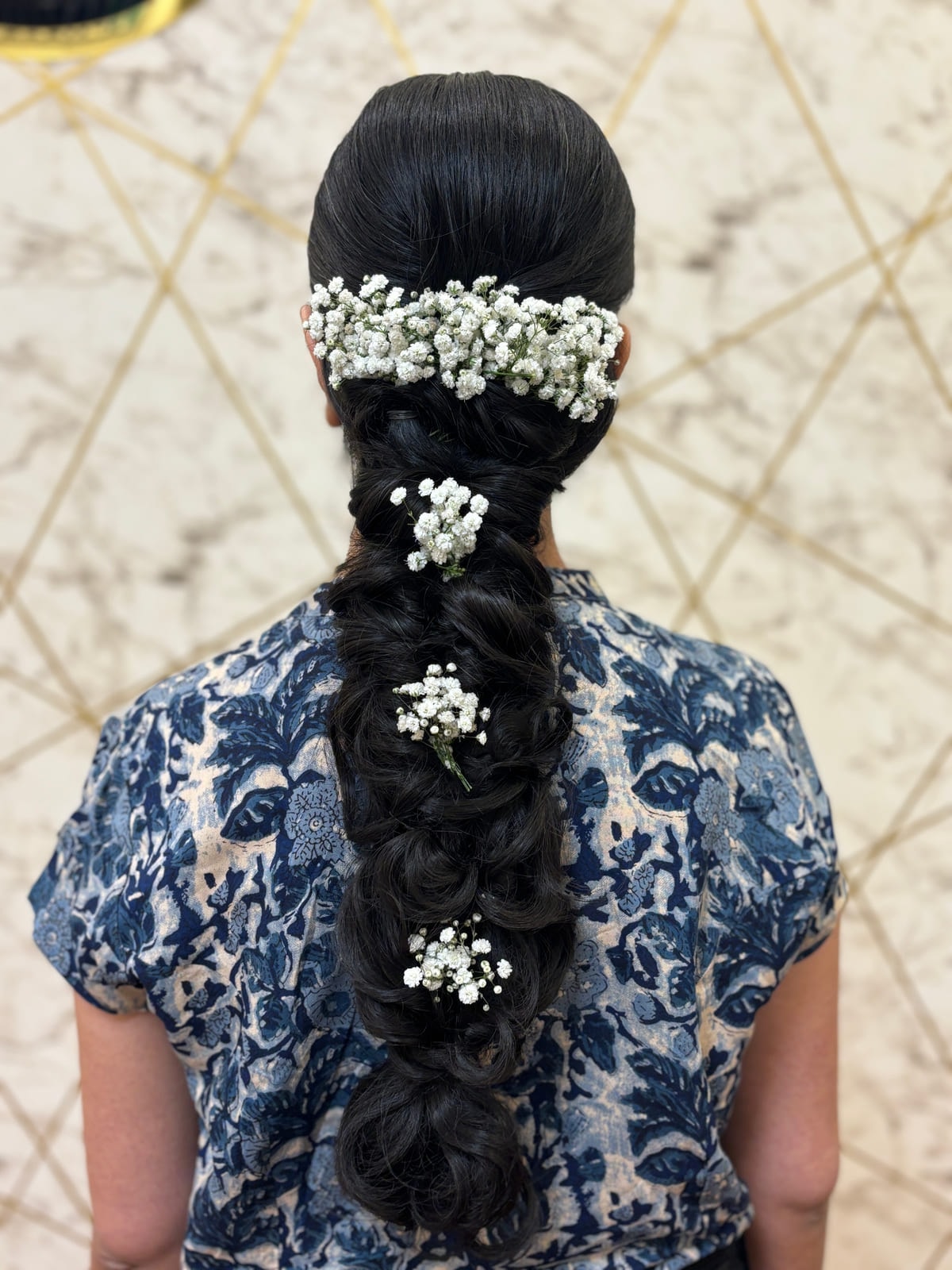 Braided Hairstyle with Baby Breath Hair Accessories. Bridal and party hairstyling by Madhu Gupta at MG Makeovers, Gurugram