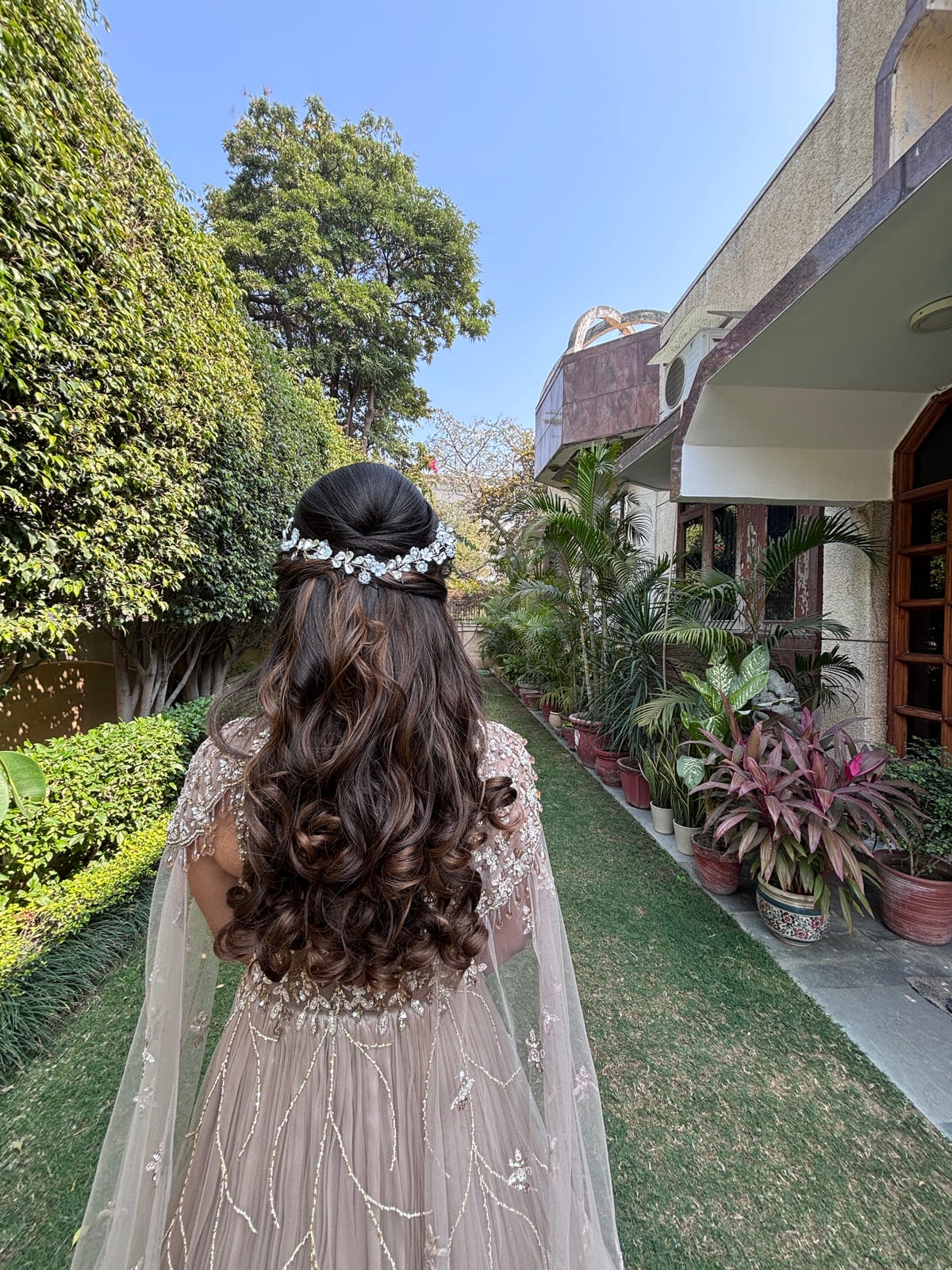 Front Twisting Open Hairstyle with Bounce. Bridal and party hairstyling by Madhu Gupta at MG Makeovers, Gurugram