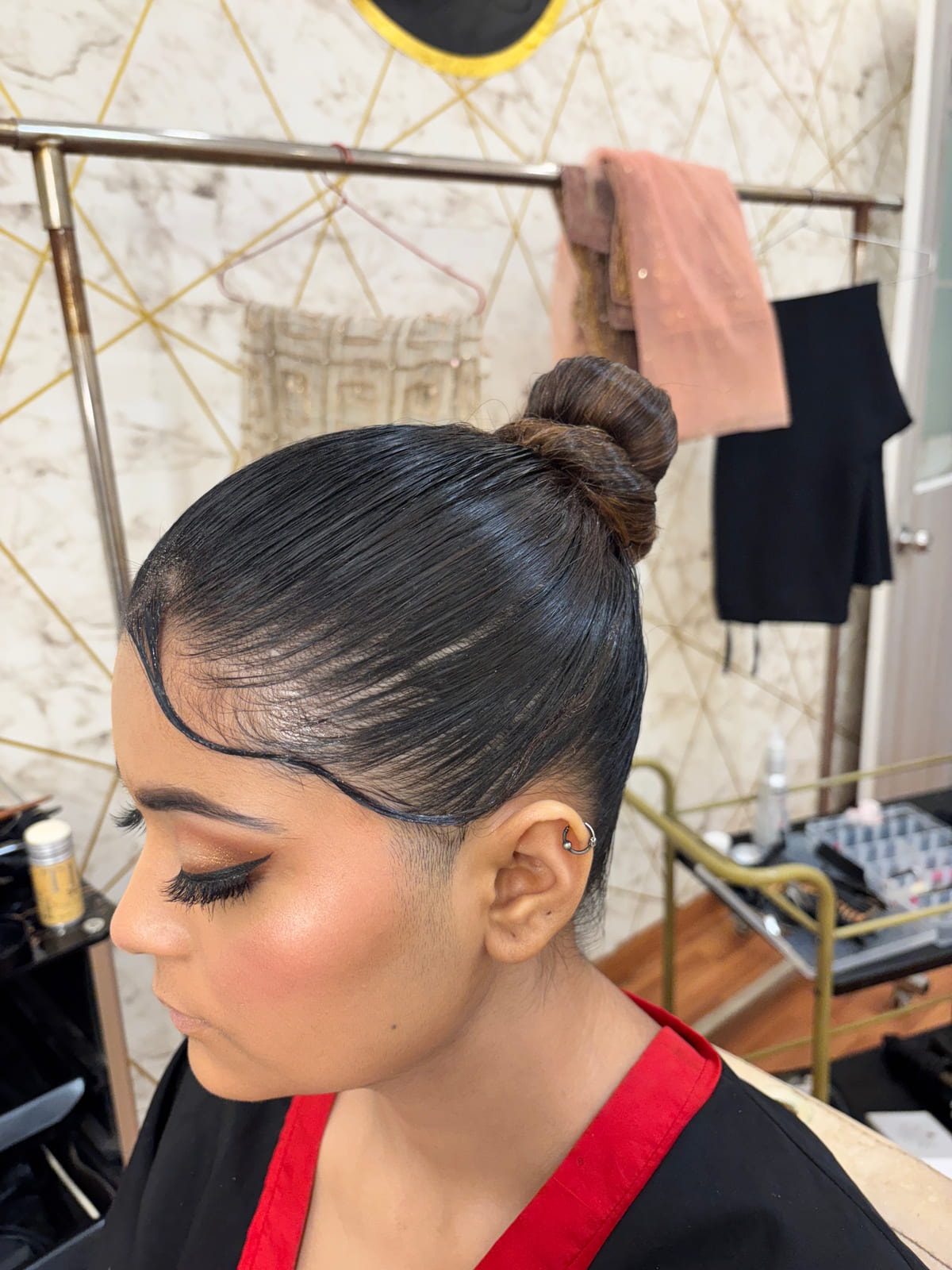 High Sleek Bun. Bridal and party hairstyling by Madhu Gupta at MG Makeovers, Gurugram