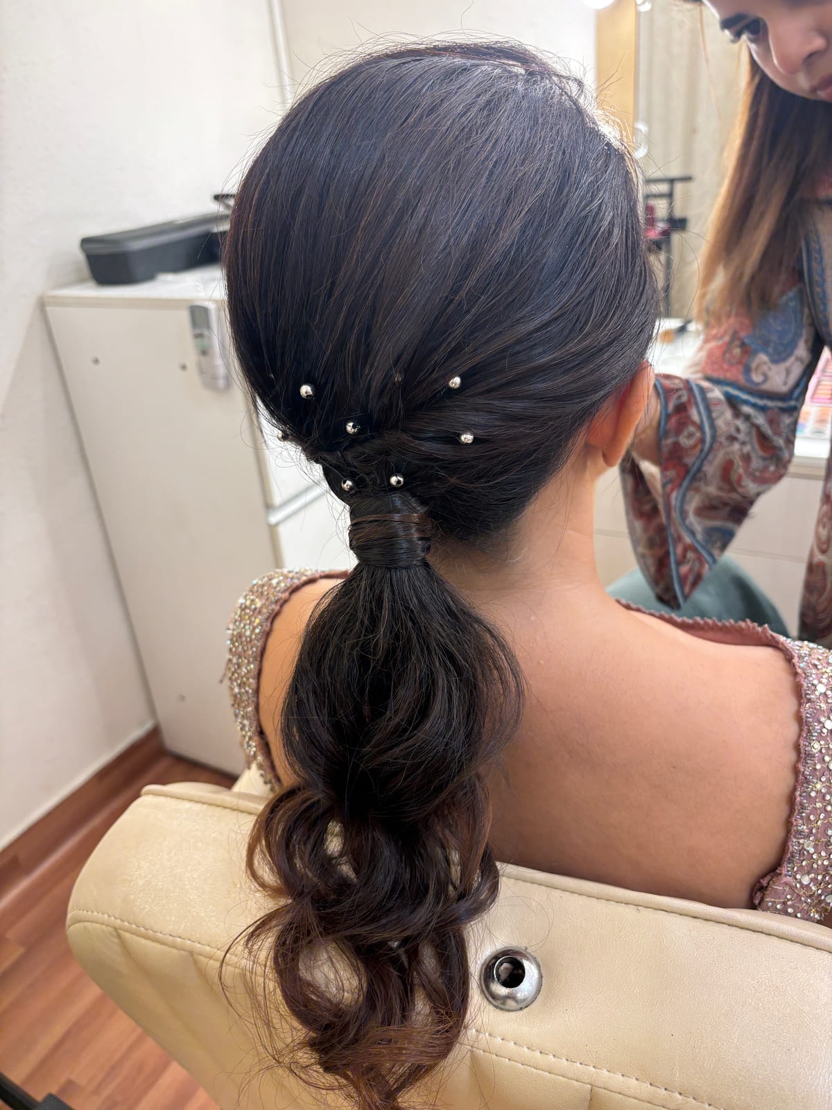 Low Pony Tail with Curls and Pearls. Bridal and party hairstyling by Madhu Gupta at MG Makeovers, Gurugram