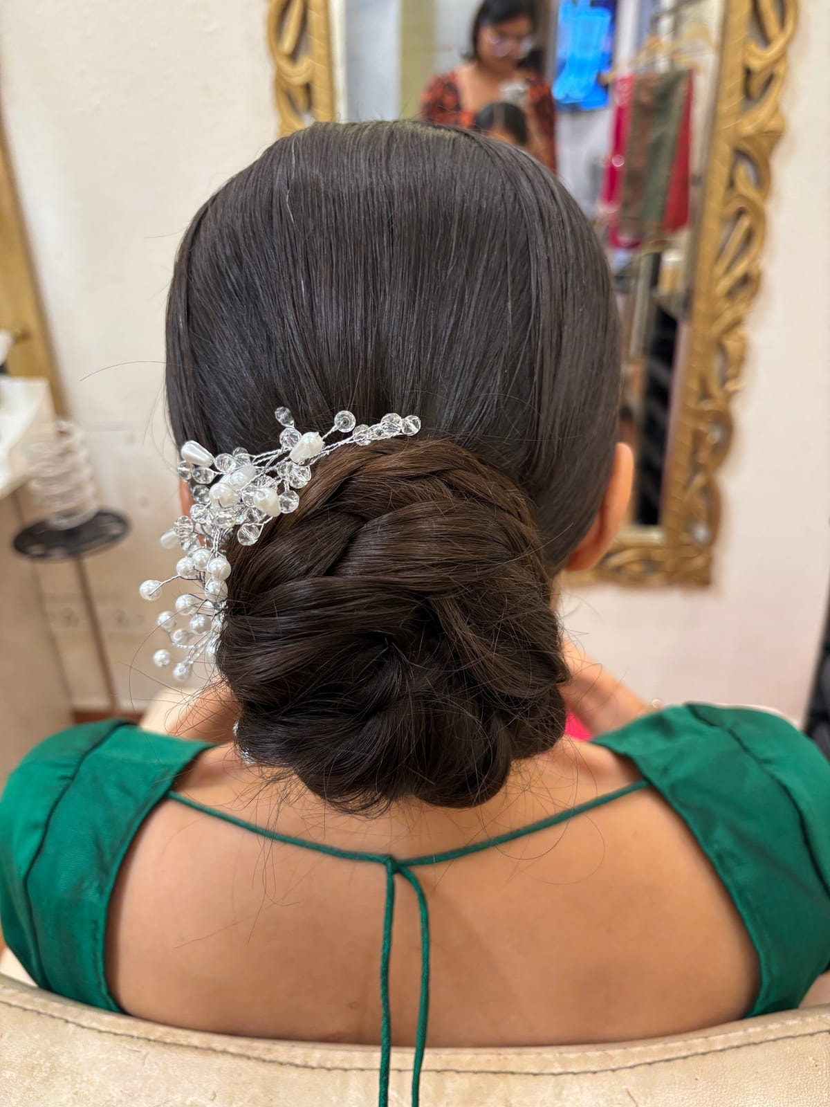 Messy Sleek Bun with Pearl Accessories. Bridal and party hairstyling by Madhu Gupta at MG Makeovers, Gurugram