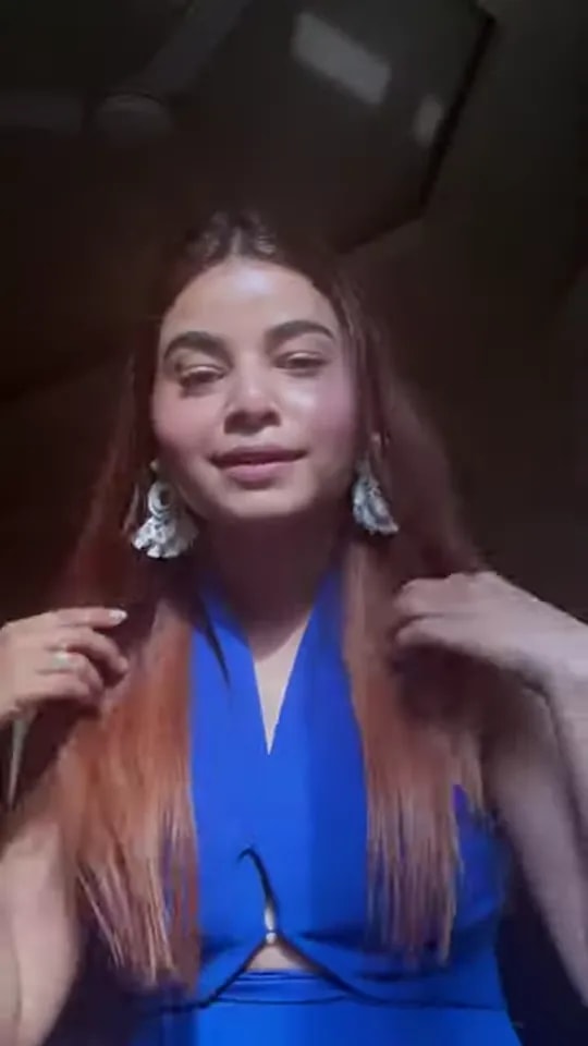 Video thumbnail: presenter in a cobalt blue top and silver jhumkas introducing the top 5 makeup products for summer
