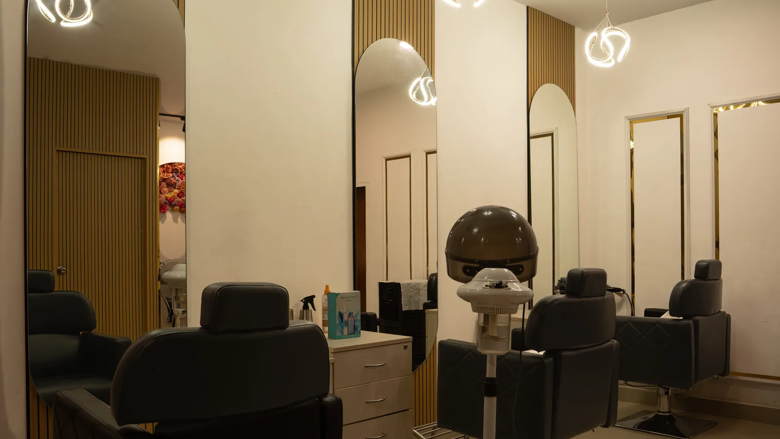 Hair service studio with styling chairs and mirrors at MG Makeovers