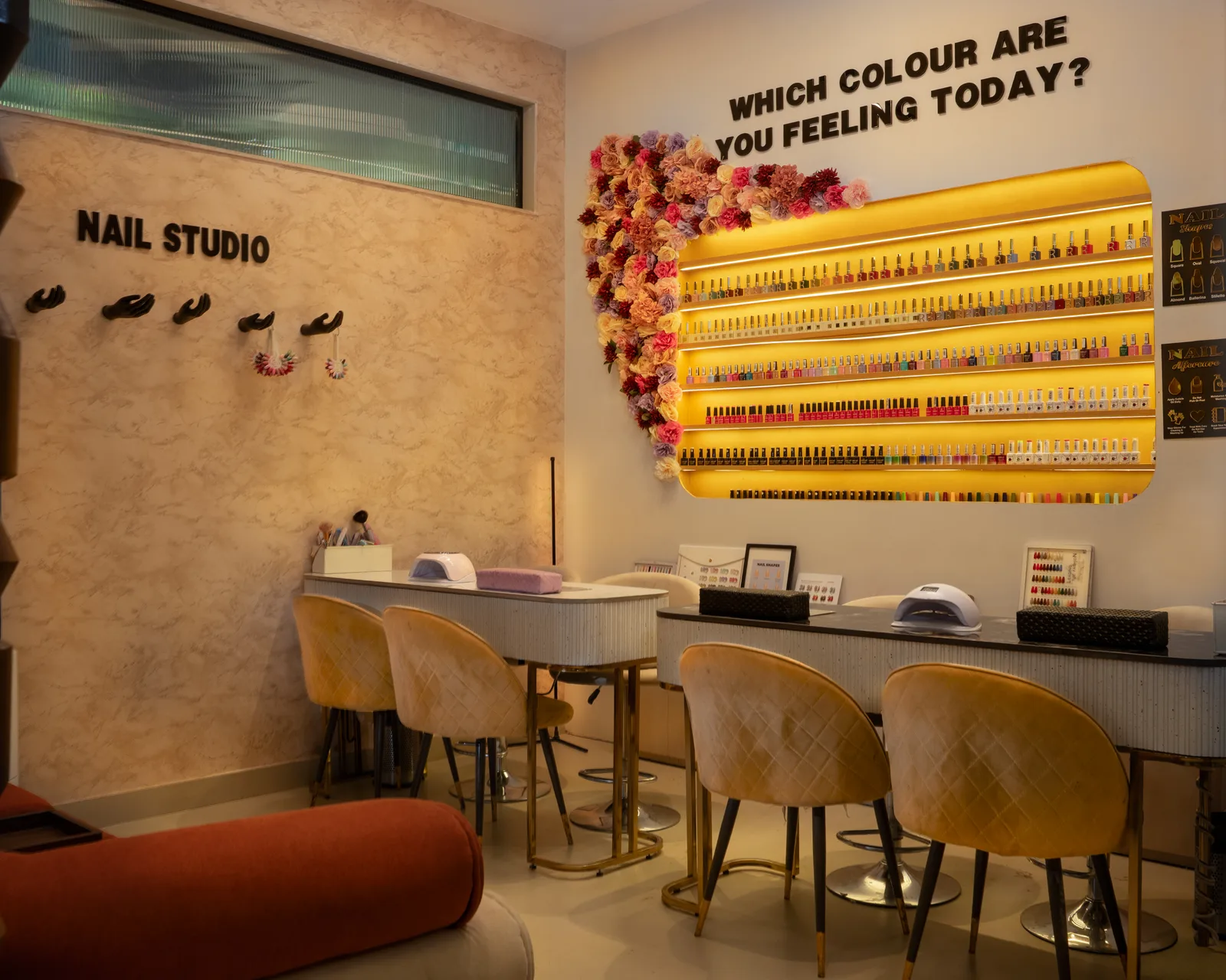 Nail studio with polish collection and manicure stations at MG Makeovers