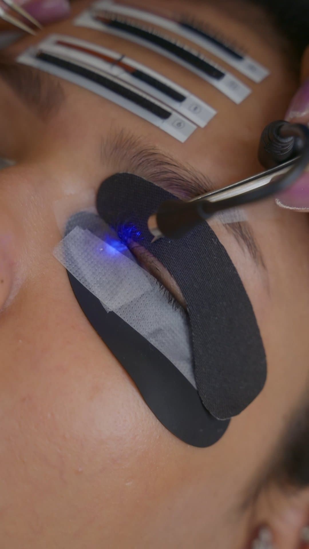 UV LED wand curing individual lash extensions at MG Makeovers Gurugram