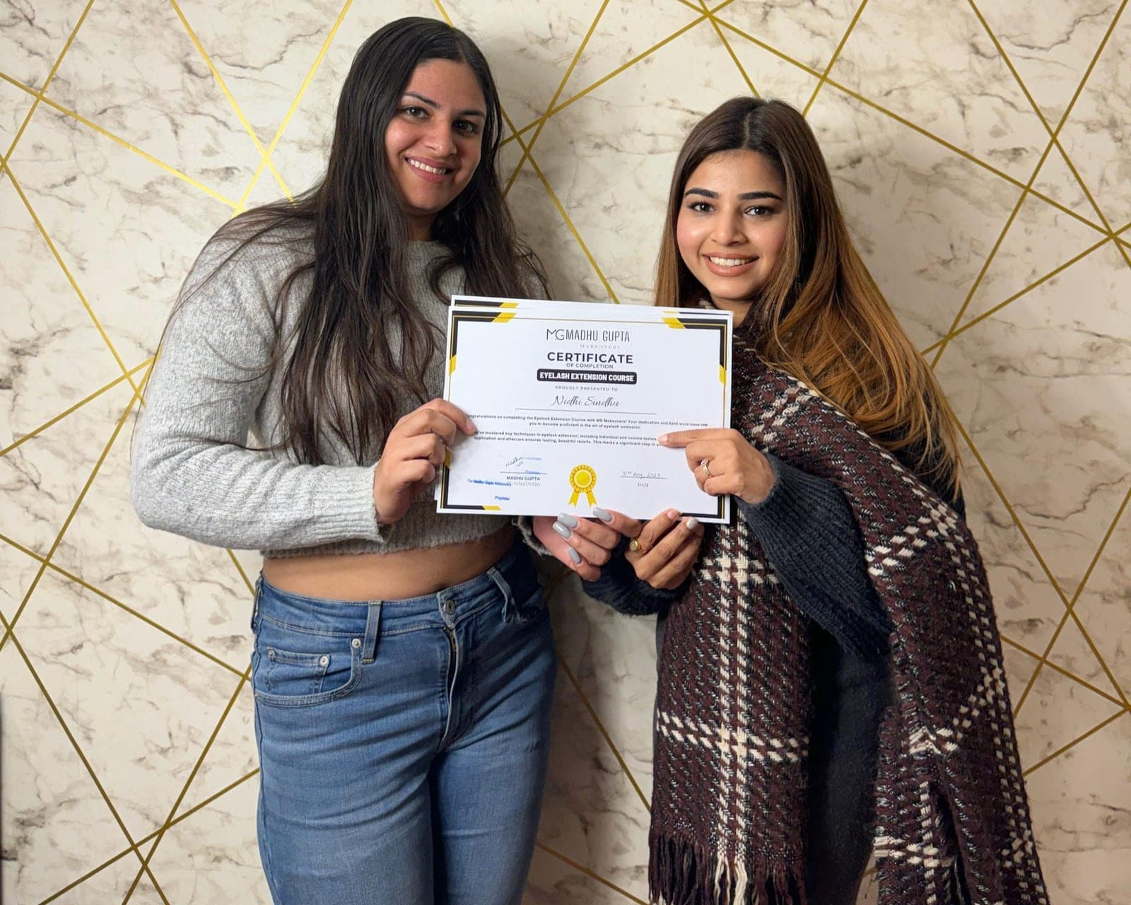 MG Makeovers Academy students holding their course certificates