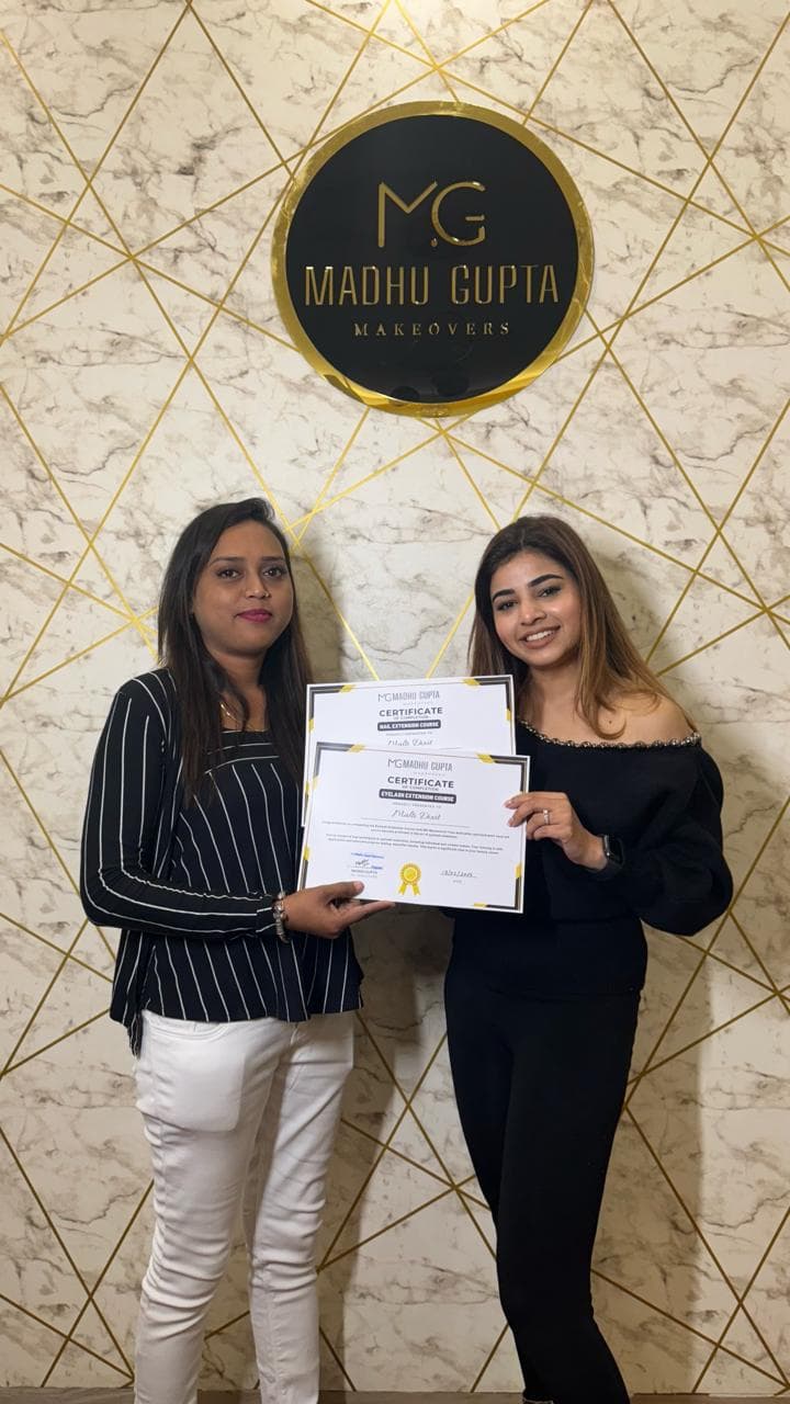 Eyelash extension course student with their MG Makeovers certificate