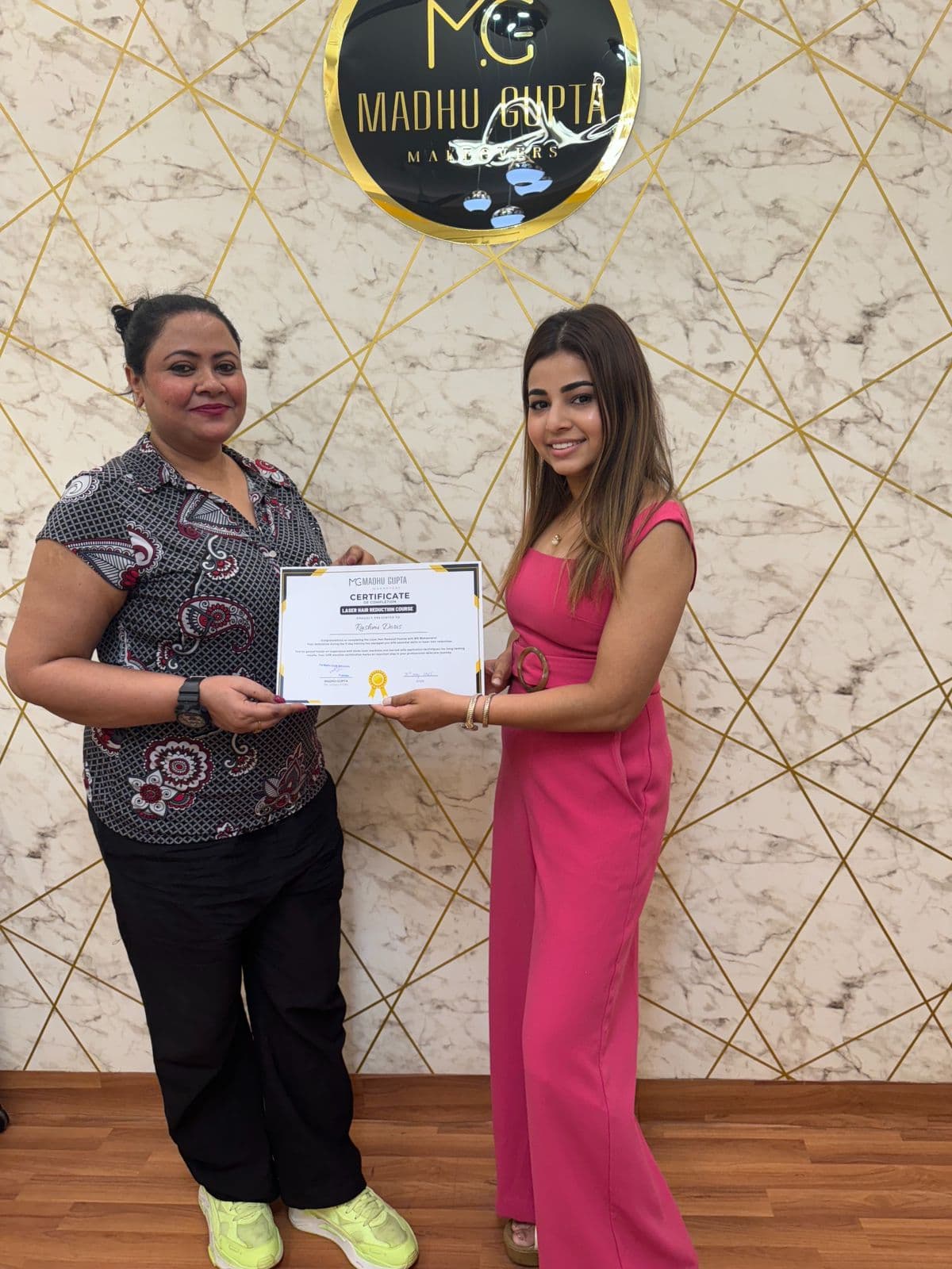 Eyelash extension course student with their MG Makeovers certificate