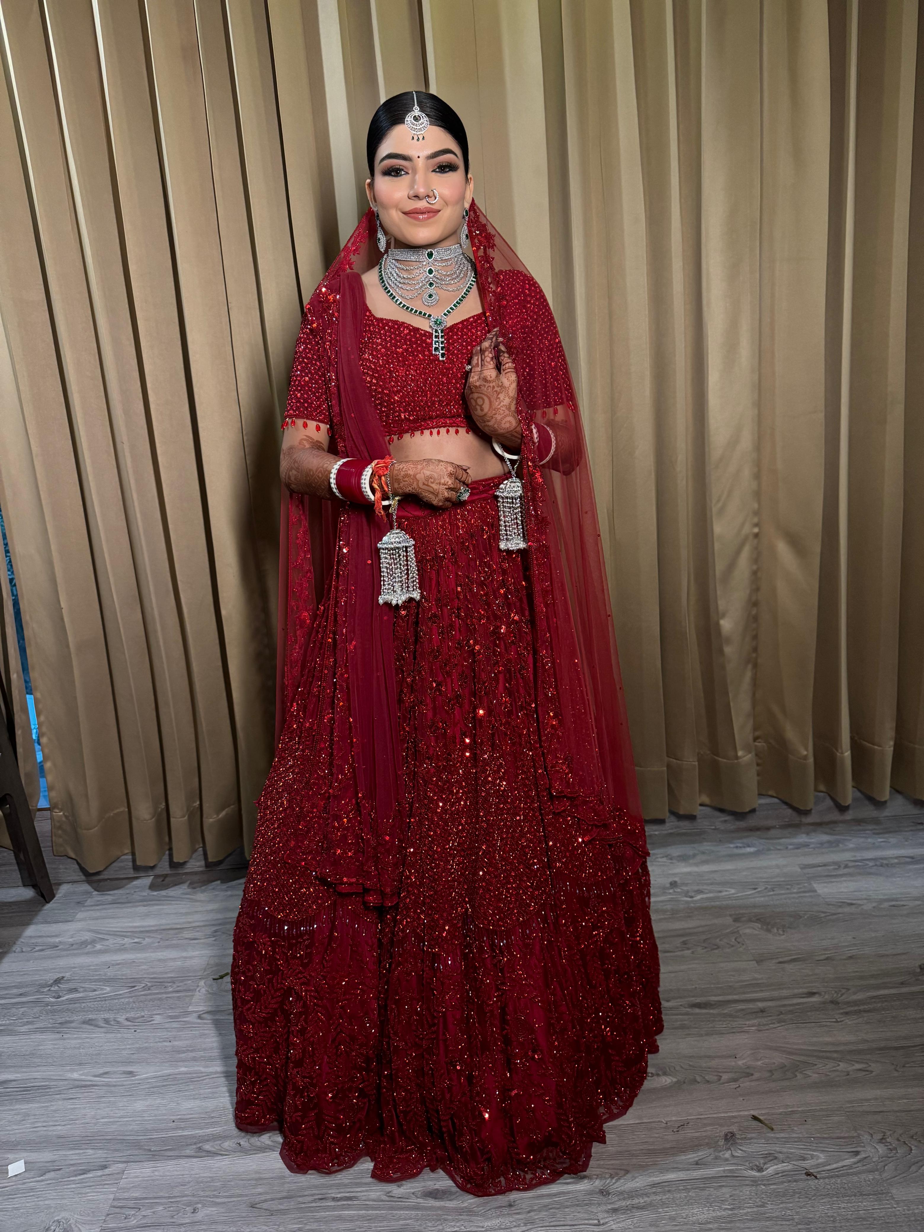 Bride in full bridal makeup and hairstyling by MG Makeovers, Gurgaon
