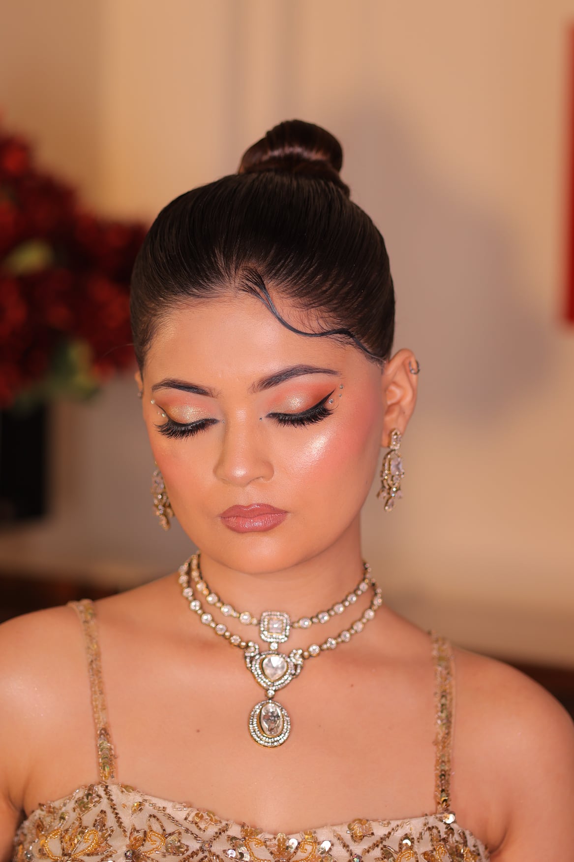 Cocktail party makeup look with shimmer, glow and a glossy lip