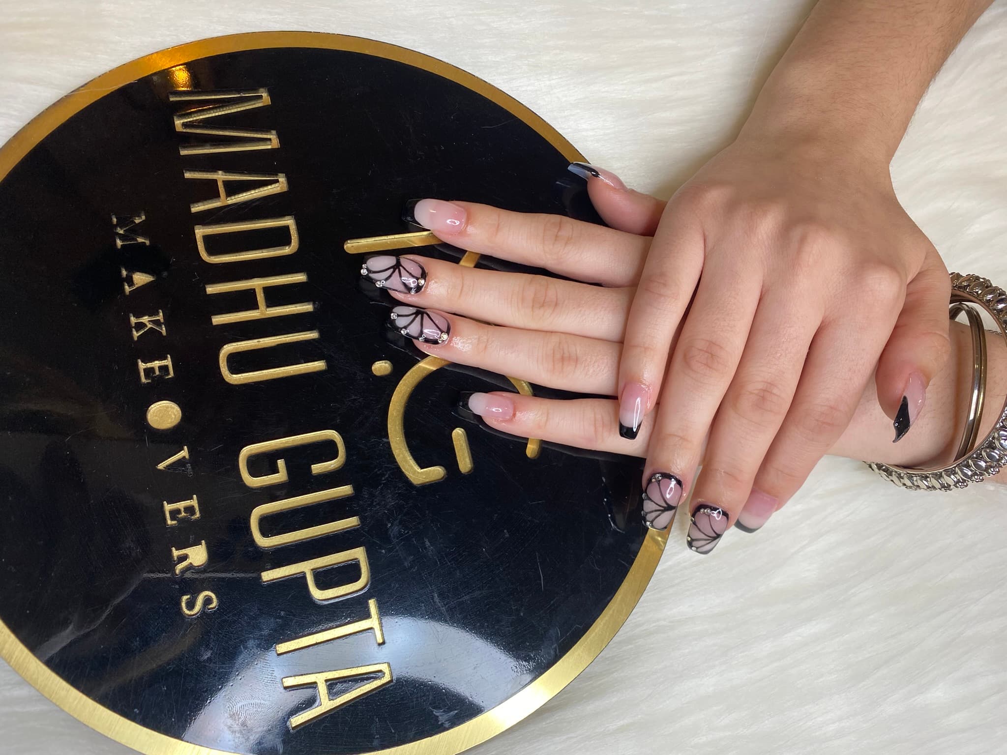 Black butterfly nail art with rhinestones on the MG Makeovers plate