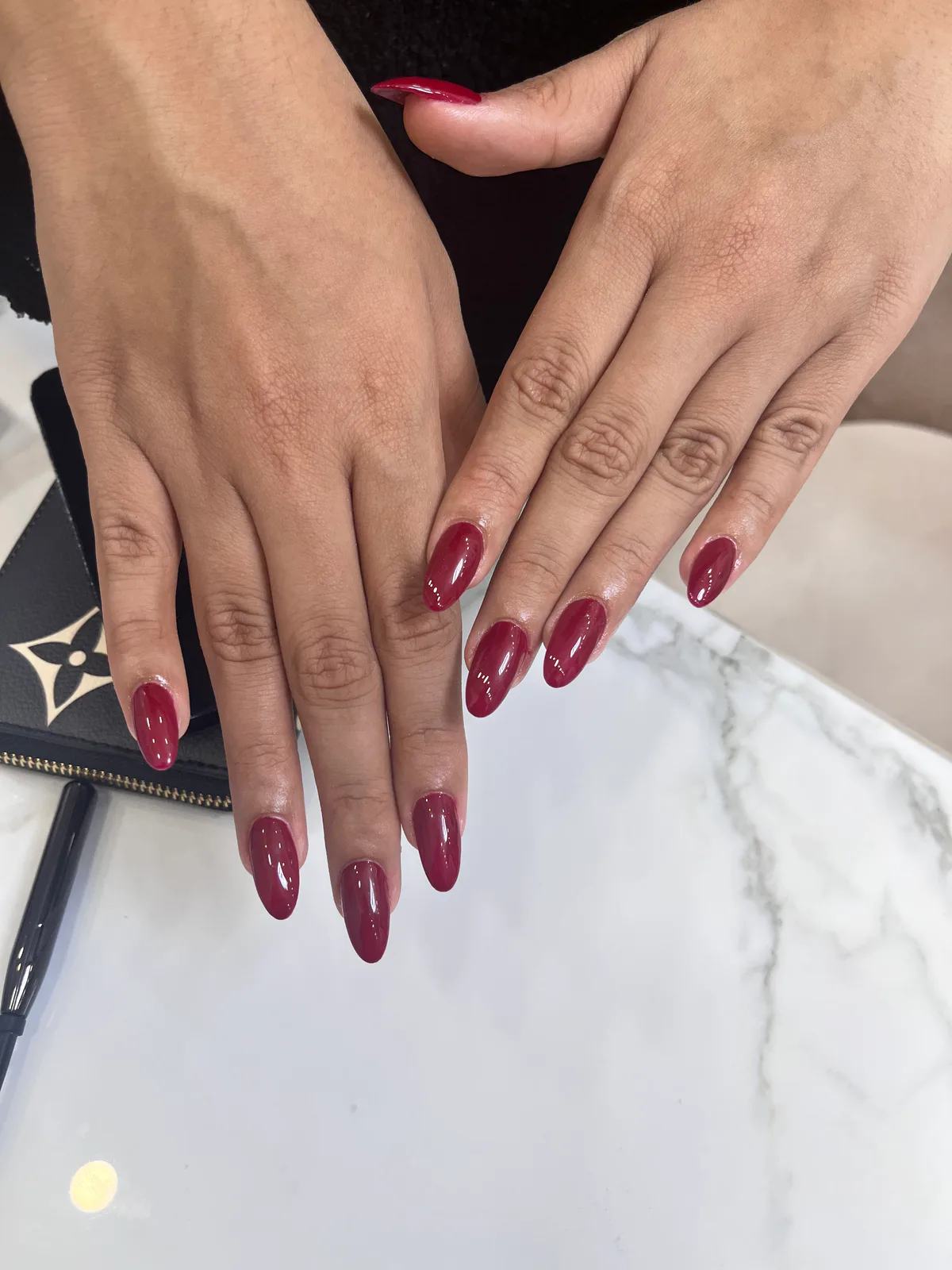 Burgundy Glossy Almond Nails Burgundy Glossy Almond Nails nail art created at MG Makeovers, Gurugram