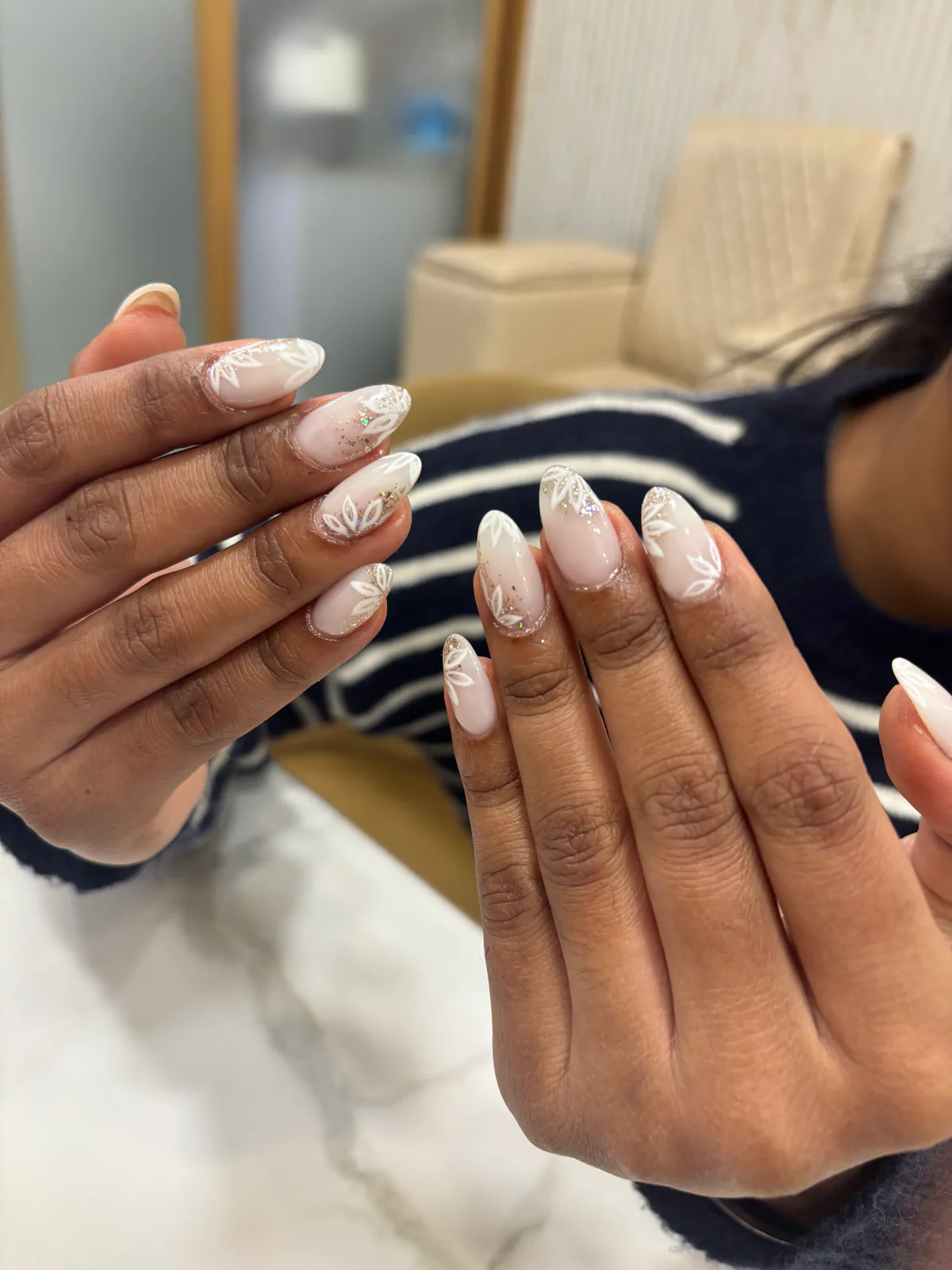 Milky White Floral Shine Nails Milky White Floral Shine Nails nail art created at MG Makeovers, Gurugram