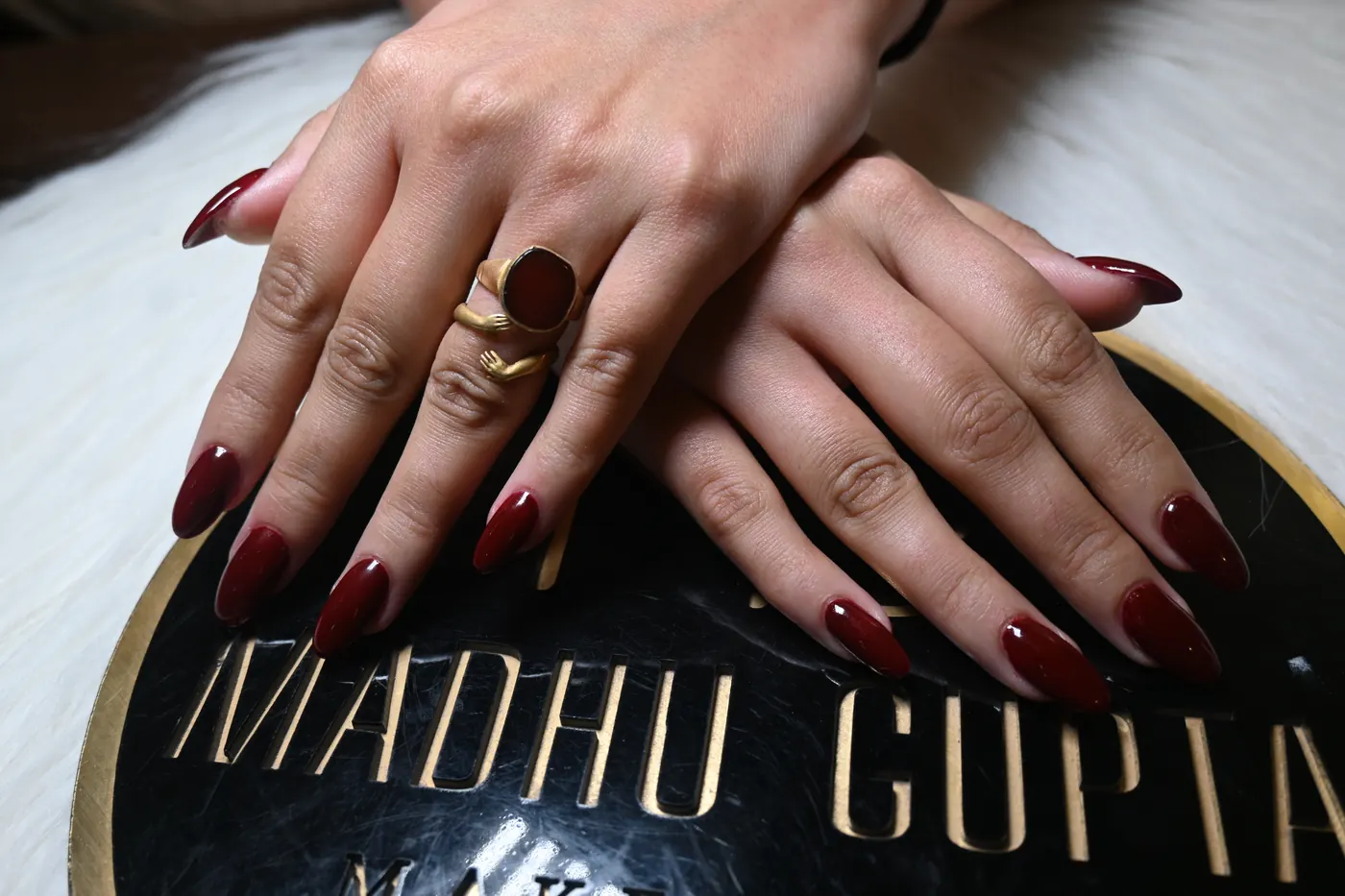 Burgundy red almond nail extensions at MG Makeovers