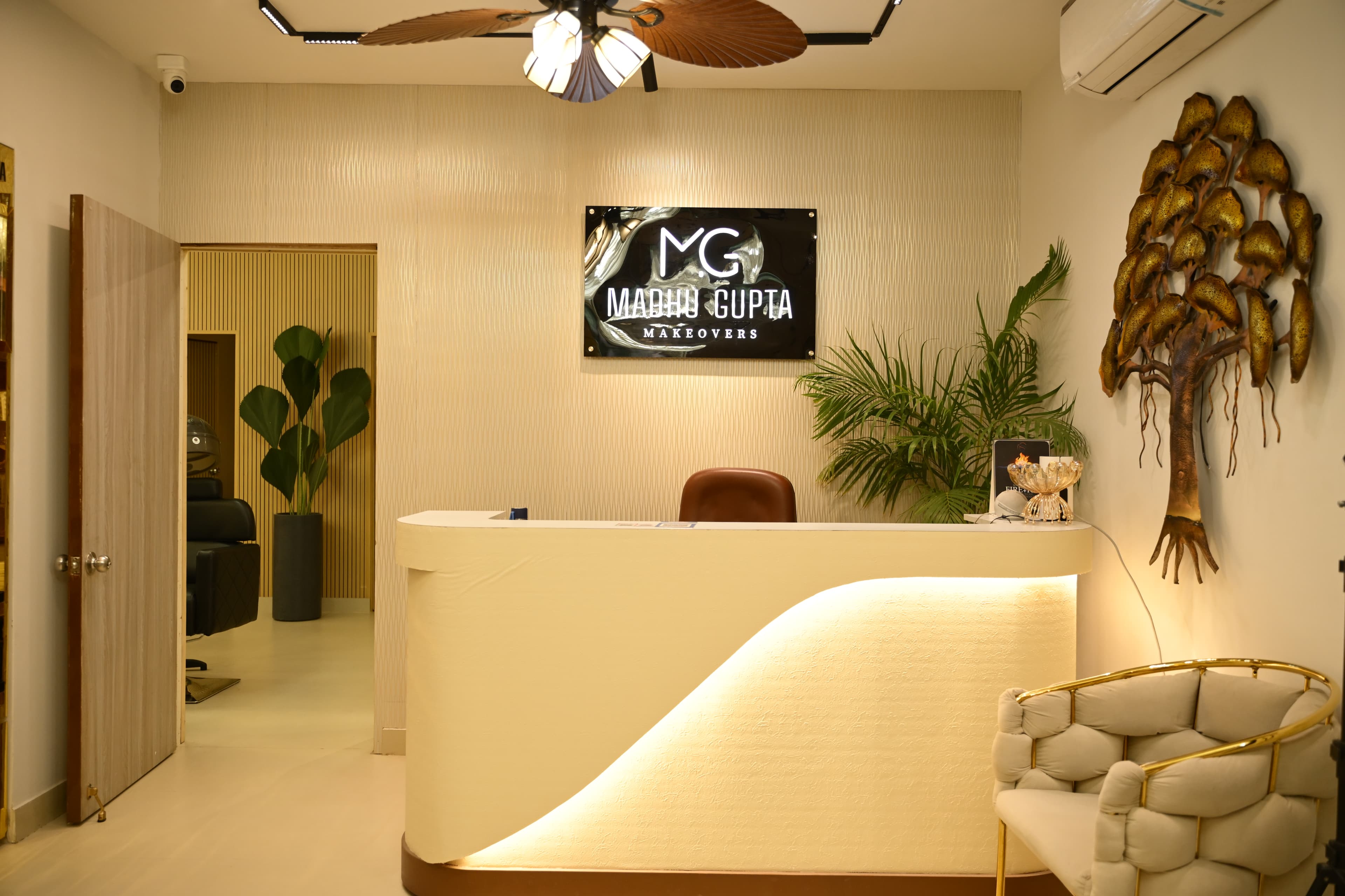 A luxury beauty studio interior in Gurgaon featuring specialized rooms for bridal makeup, hair styling, and nail art.