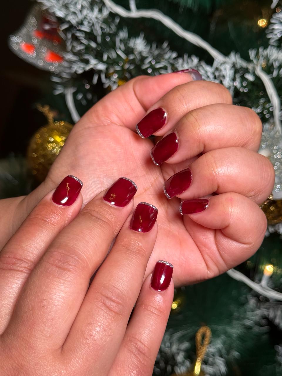 "Deep red nail polish on a client at MG Makeovers in Gurgaon, ideal for elegant occasions