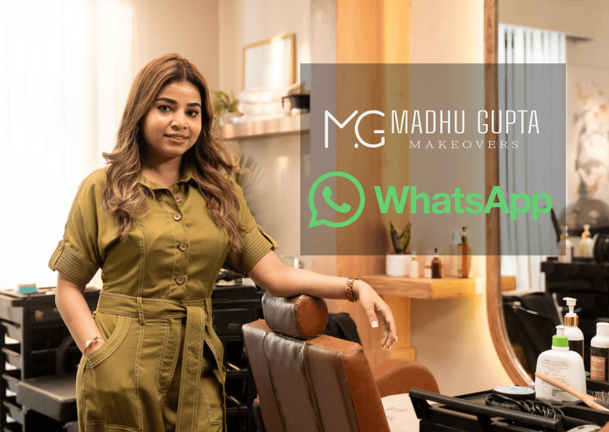 An advertisement for MG Makeovers featuring founder Madhu Gupta in a studio setting, promoting a business blueprint to scale beauty businesses using WhatsApp to generate 100 confirmed leads for ₹2,000, with Meta and WhatsApp Business